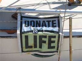 The Catalyst's weather-beaten Donate Life banner.